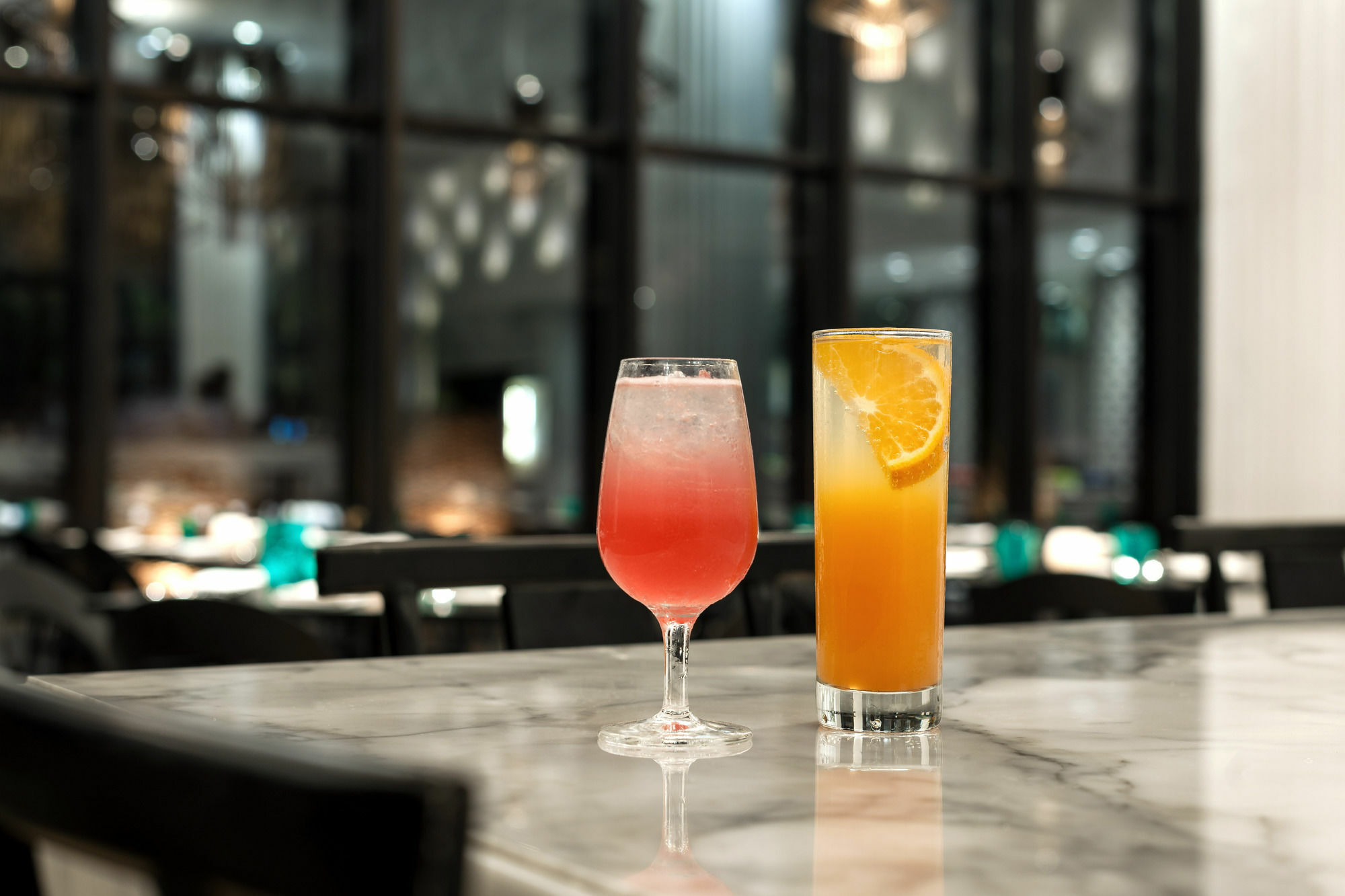 Hyatt Centric Candolim Goa Zewnętrze zdjęcie A pink and an orange cocktail